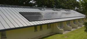 Replacement zinc standing seam roof with solar PVs