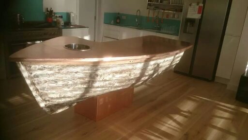 Polished copper kitchen island in the shape of a boat, Brighton