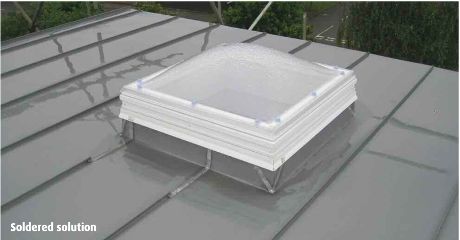 Rooflight in low pitch zinc standing seam roof with soldered seams
